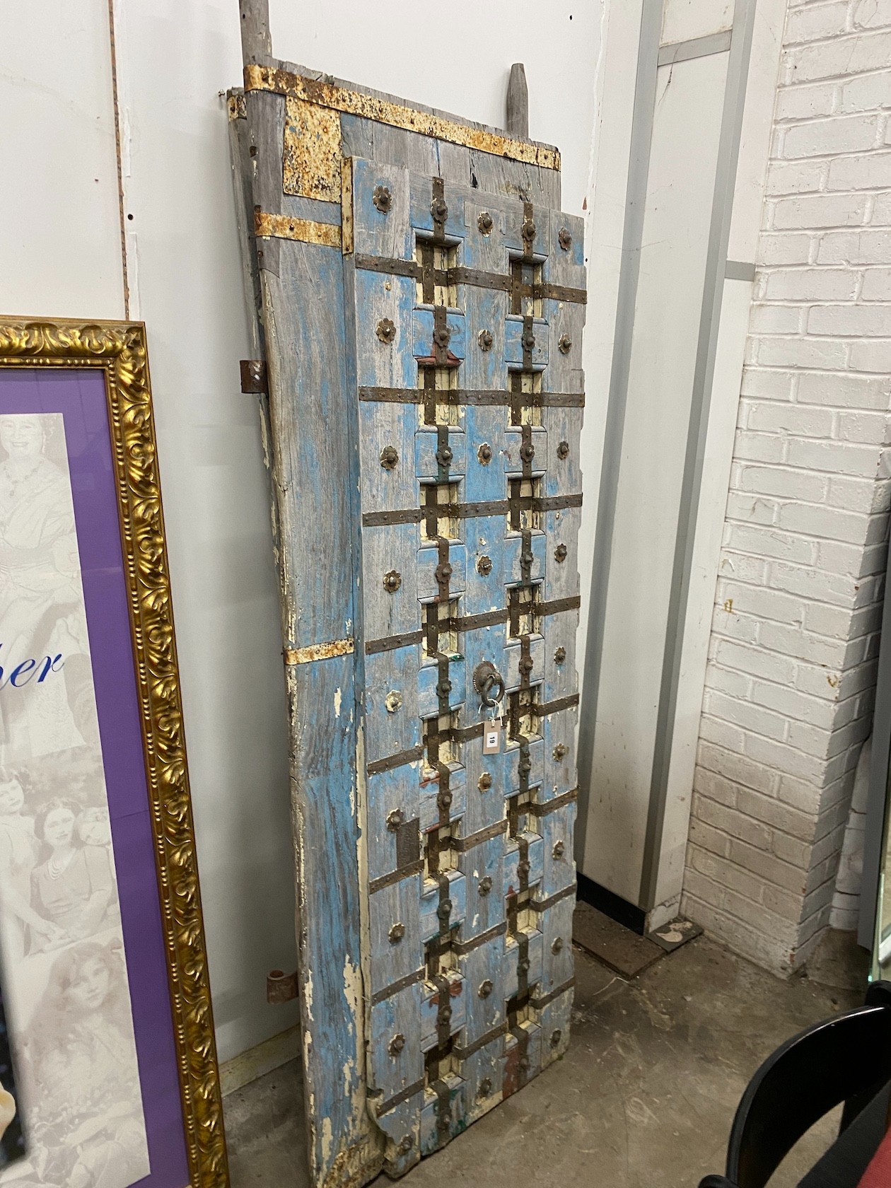 Two Moorish style iron mounted painted wood doors, larger width 71cm, height 216cm
